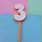 3 Cake Topper white on orange 7.5cm x 5cm