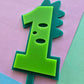 1 Dinosaur Cake Topper 10cm tall (6cm wide) green on teal