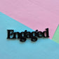 Engaged cake charm 10cm wide black