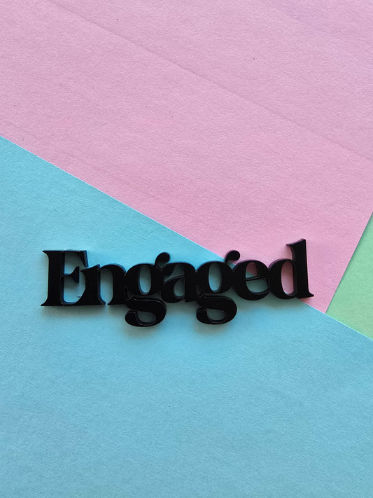 Engaged cake charm 10cm wide black